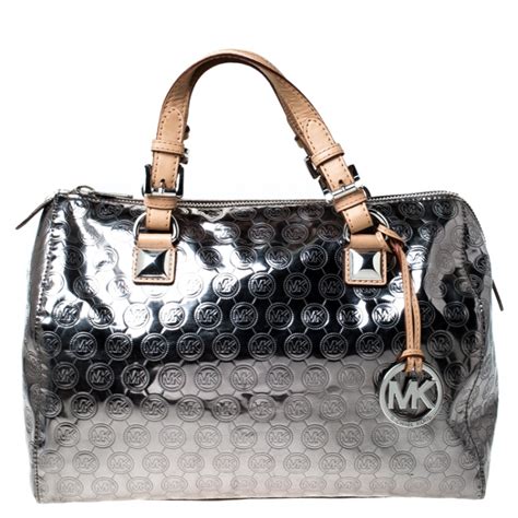 michael kors metallic pouch|silver Michael Kors crossbody bag.